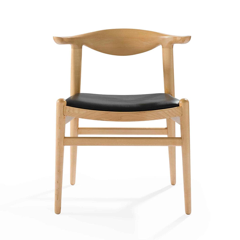 The PP505 Cow Horn Chair by Hans Wegner: A Study in Craftsmanship and Curves